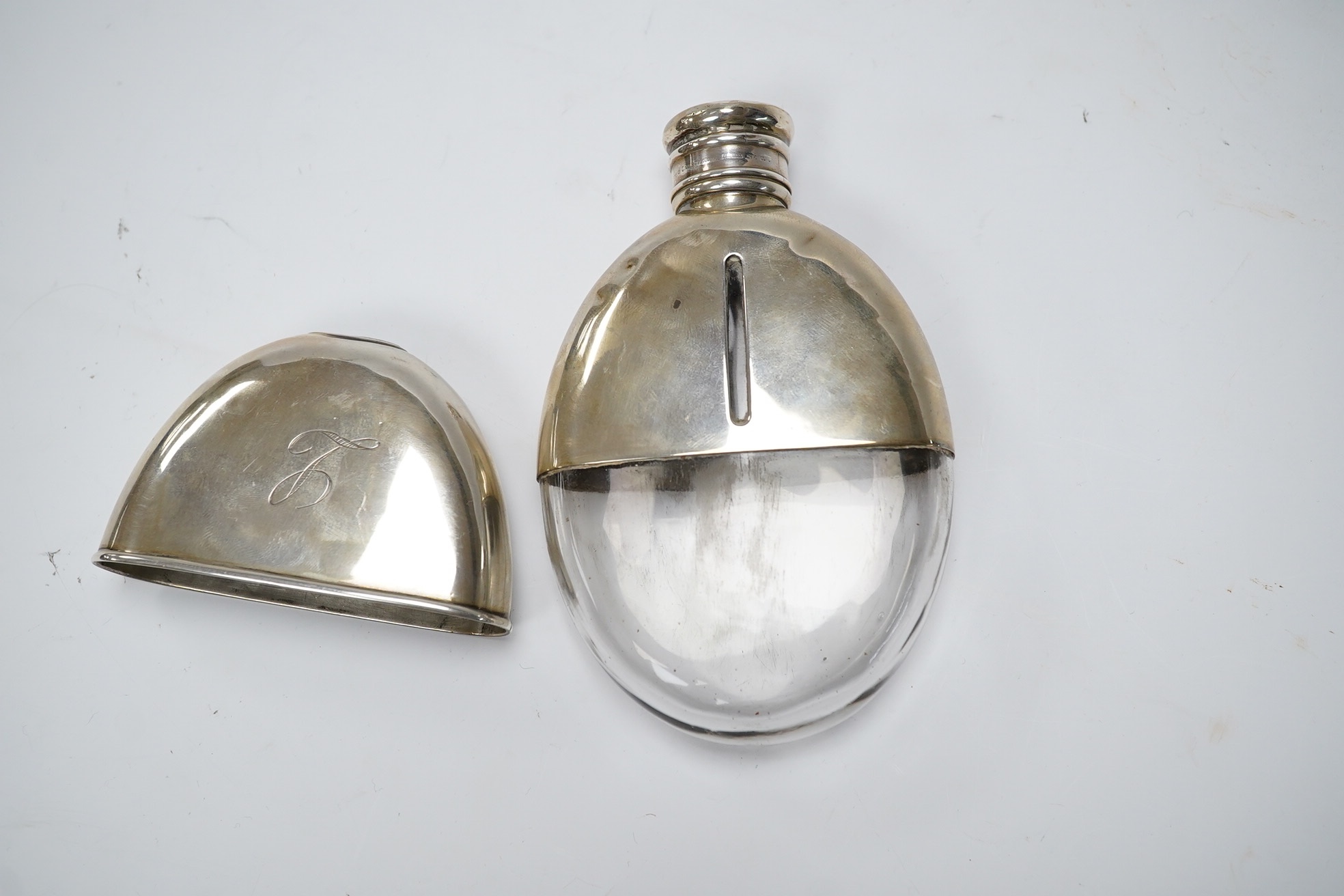 A Victorian silver oval pocket flask, John Linegar, Birmingham, 1872, 12.8cm. Condition - poor